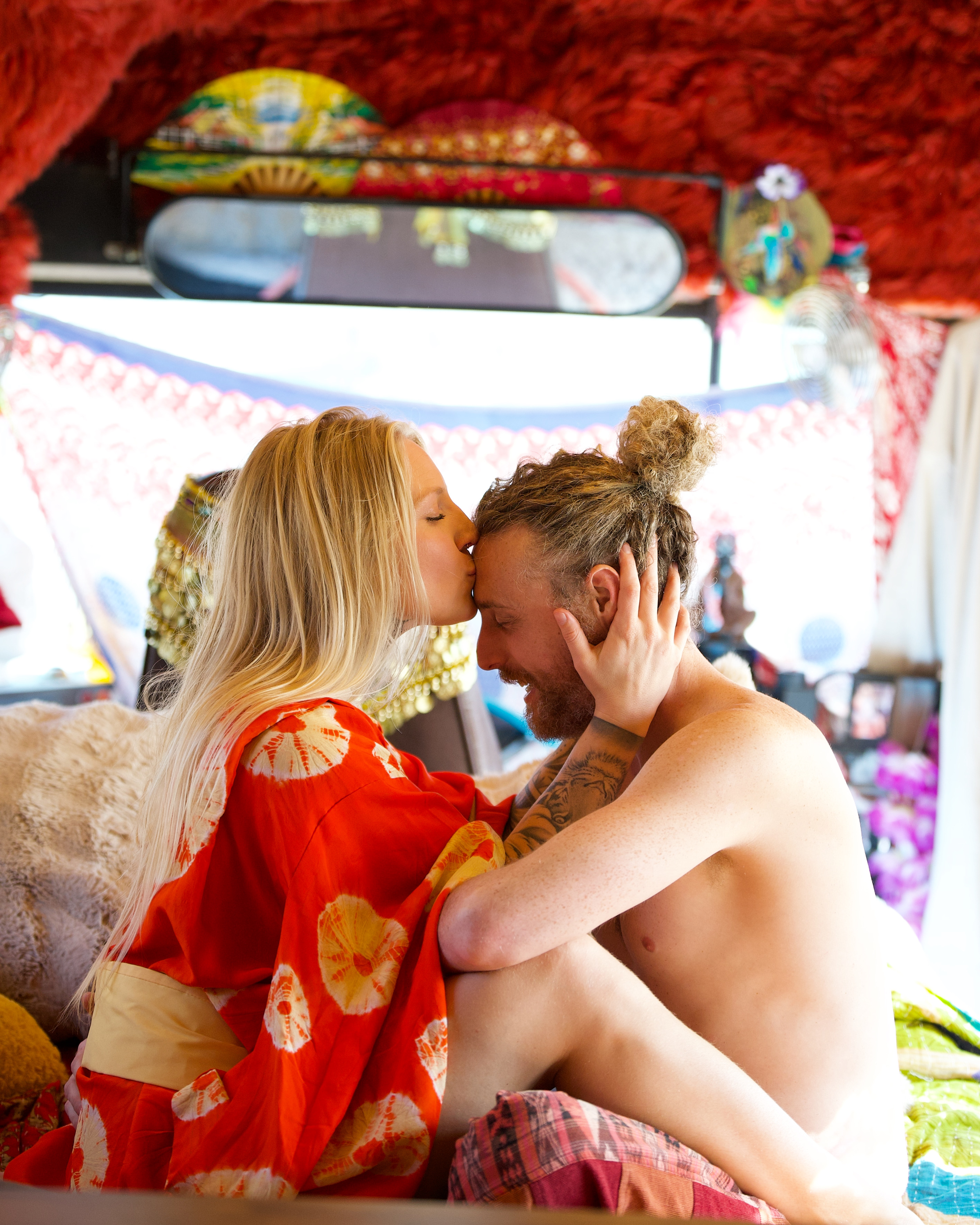 Holy Wild Music artists sharing a tender peaceful moment inside the bus